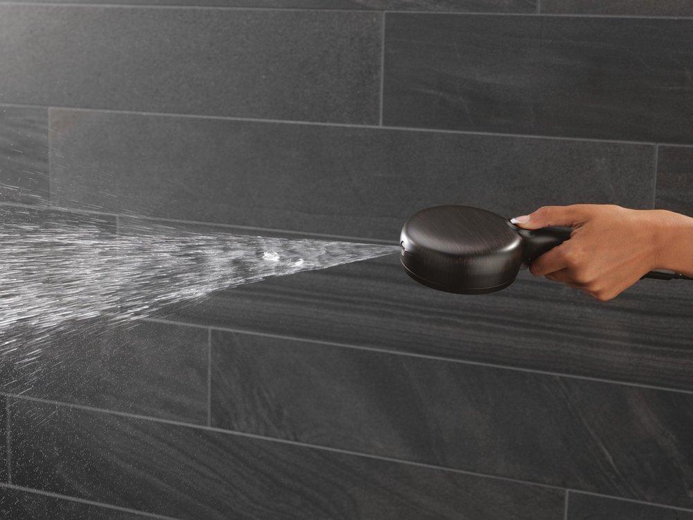 DELTA UNIVERSAL SHOWERING COMPONENTS: 7-SETTING SLIDE BAR HAND SHOWER WITH CLEANING SPRAY 