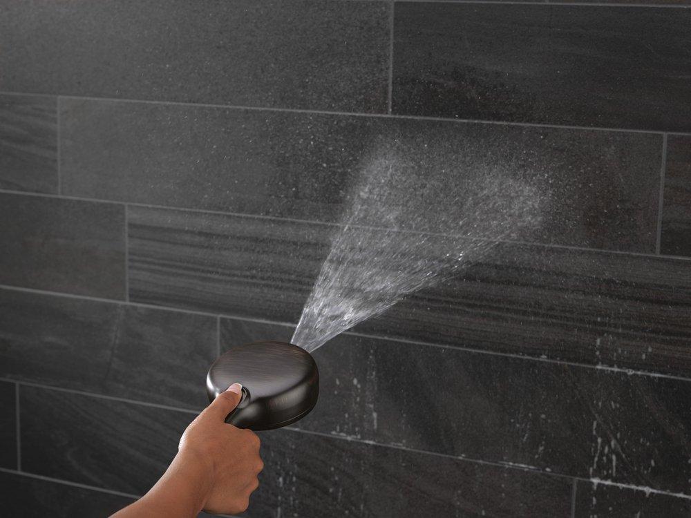 DELTA UNIVERSAL SHOWERING COMPONENTS: 7-SETTING WALL MOUNT HAND SHOWER WITH CLEANING SPRAY 