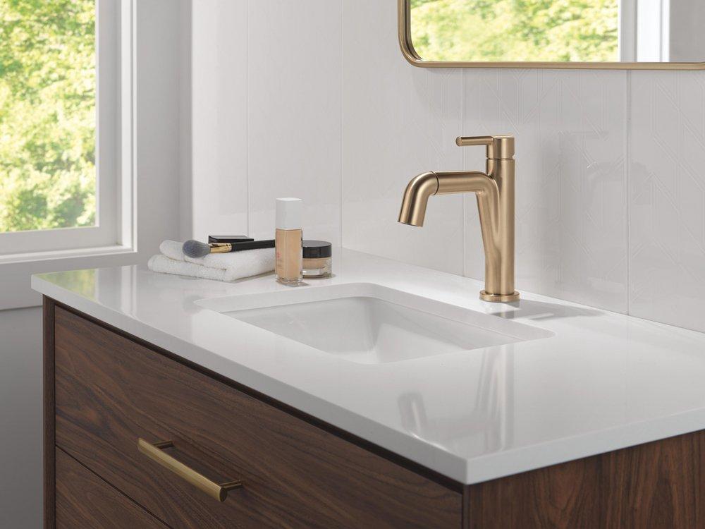 Single Handle Monoblock Bathroom Sink Faucet in Champagne Bronze 