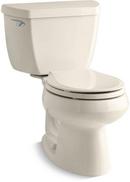 1.28 gpf Round Toilet in Almond with Left-Hand Trip Lever