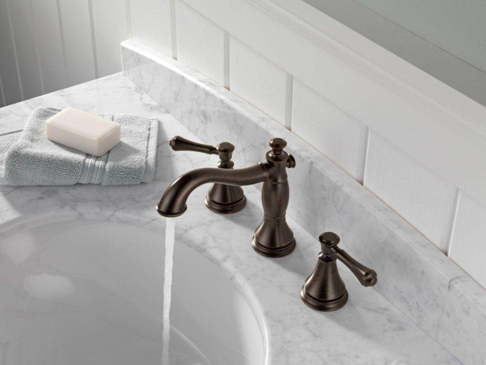 Delta Faucet Venetian Bronze Two Handle Widespread Bathroom Sink Faucet with Pop-Up Drain Assembly 