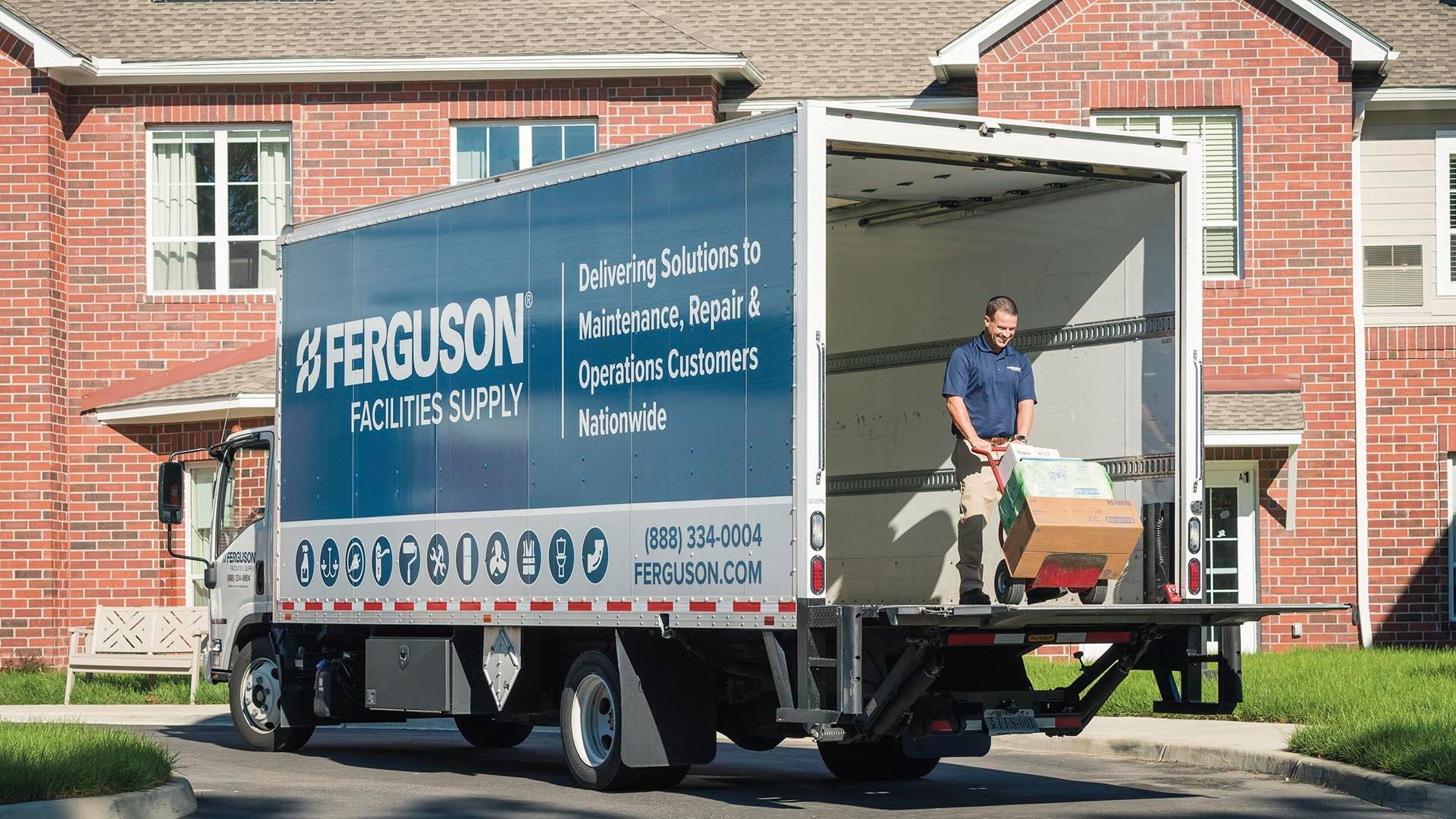 Ferguson associate moving items in a delivery truck