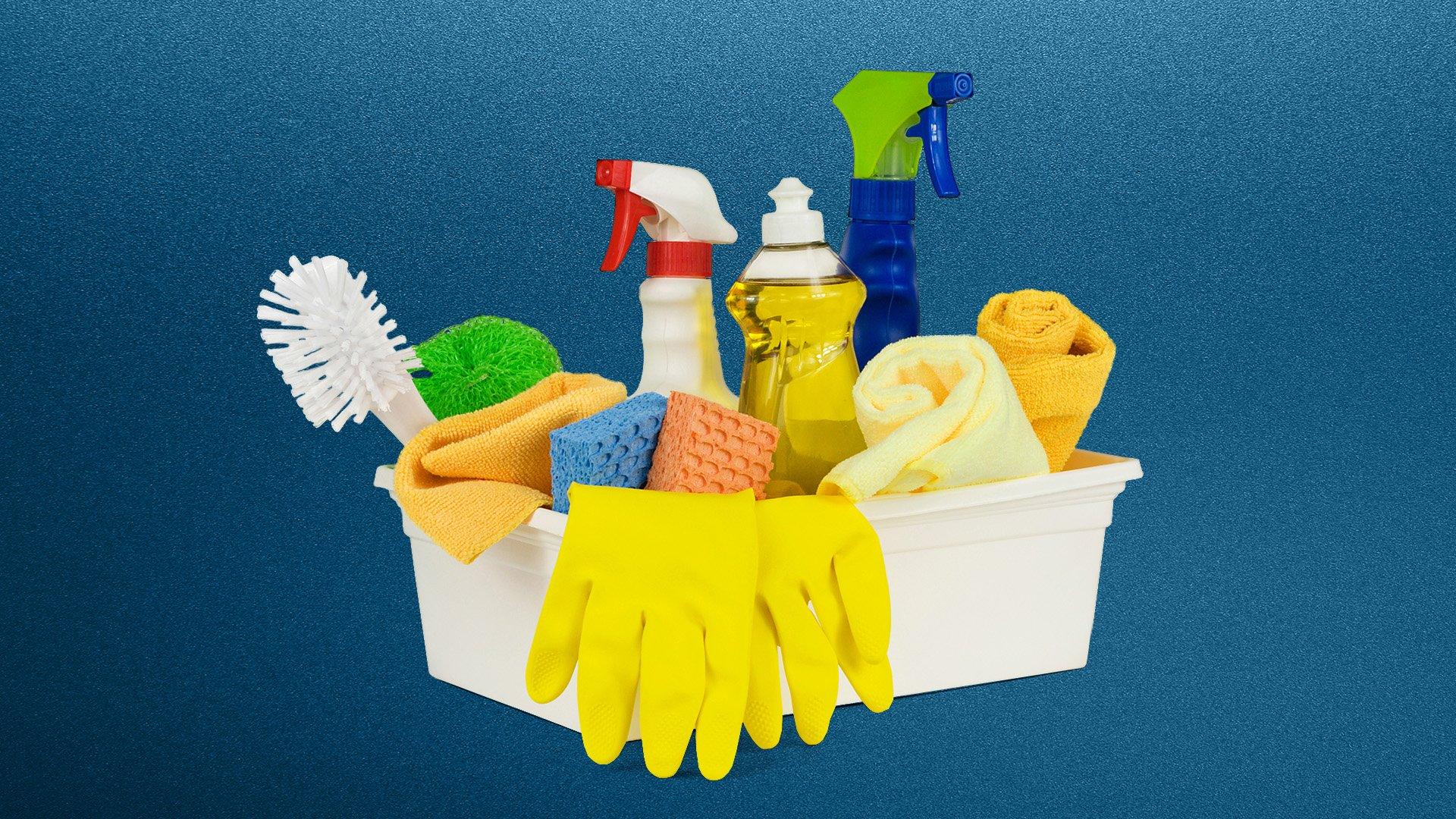 Janitor supplies including spray bottles, sponges, gloves and scrubbers in a white tub with blue background.