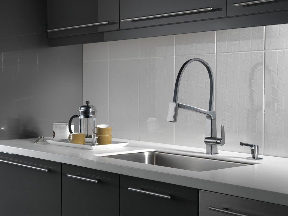 Delta Faucet Arctic Stainless 13 oz. Deck Mount Metal Soap & Lotion Dispenser 