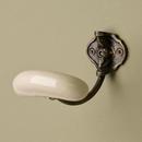 Brass Hook with Porcelain Knob in Antique Brass