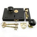 Cast Iron Rim Lock Set with Black Porcelain Knobs Left Hand in Polished Brass
