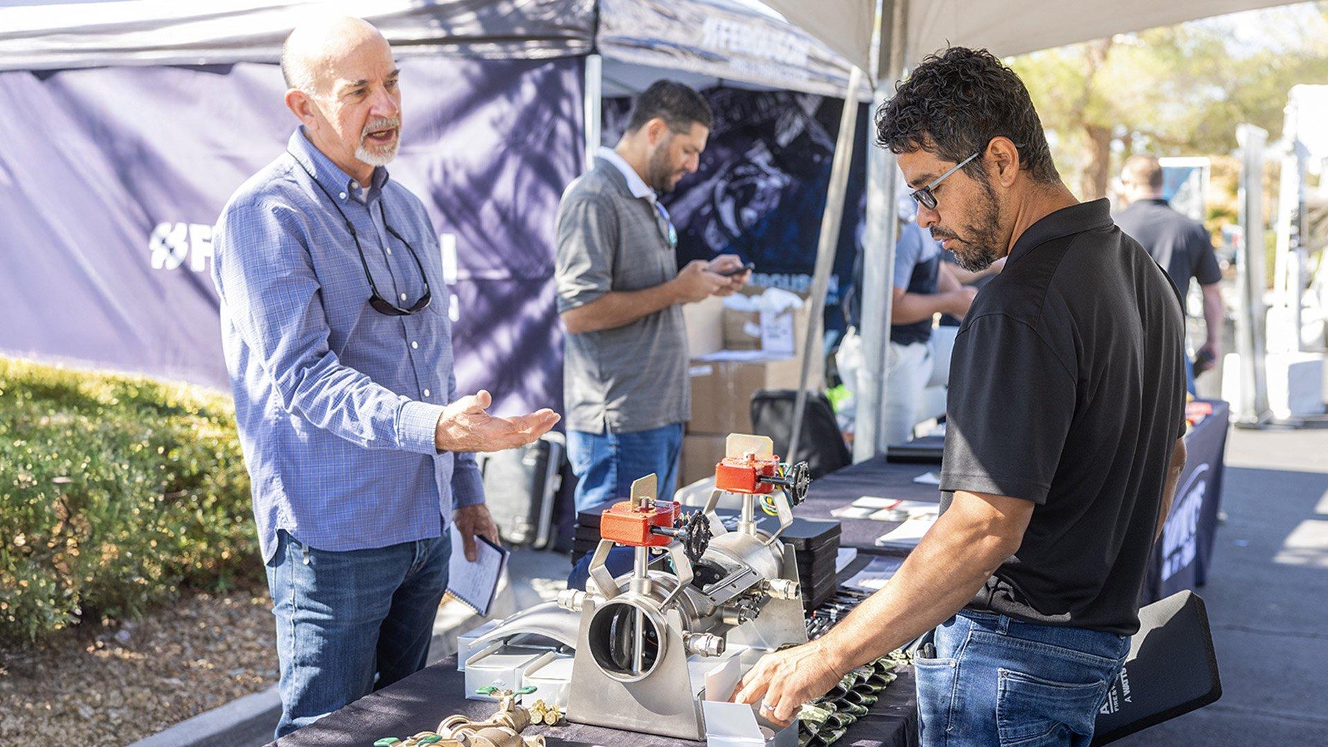 Ferguson associate shows products to customer at Trade Pro Tour