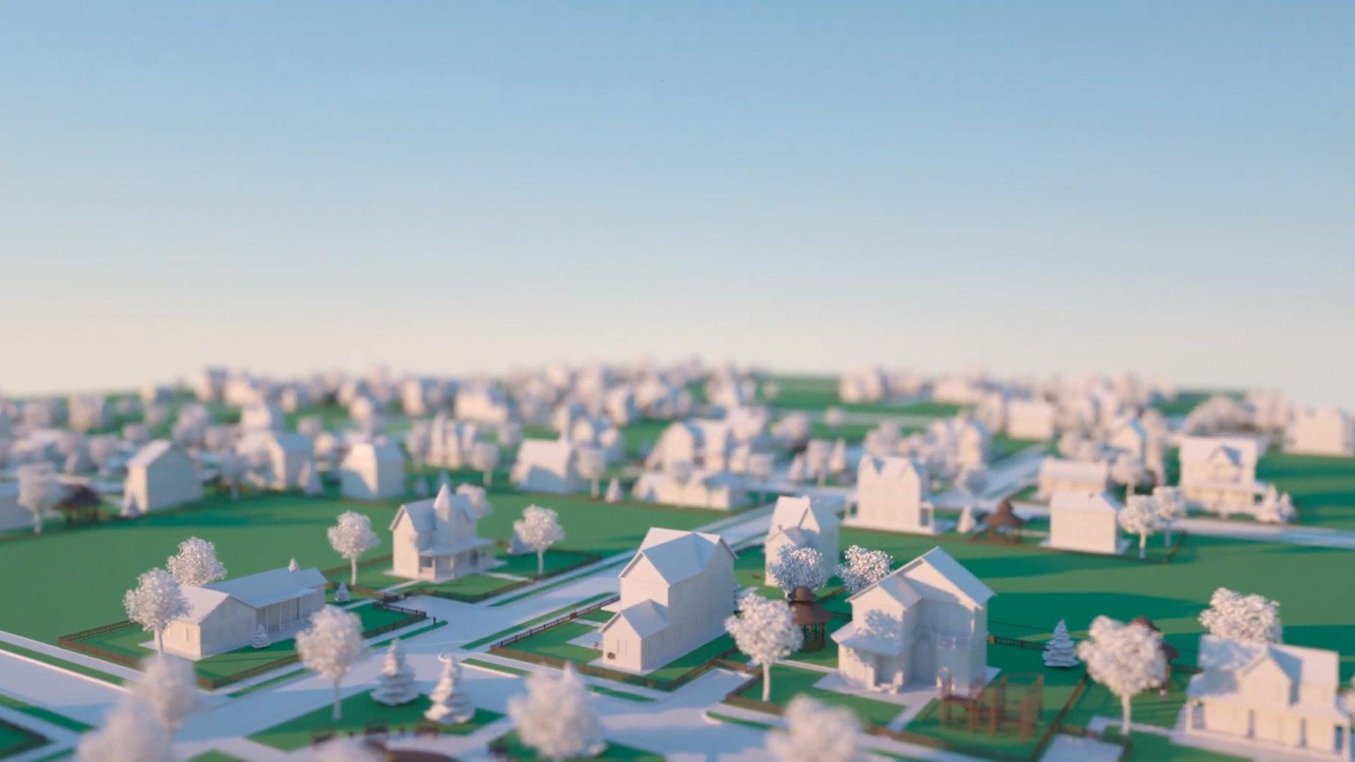 A close-up view of a model neighborhood with houses and trees in white and green lawns