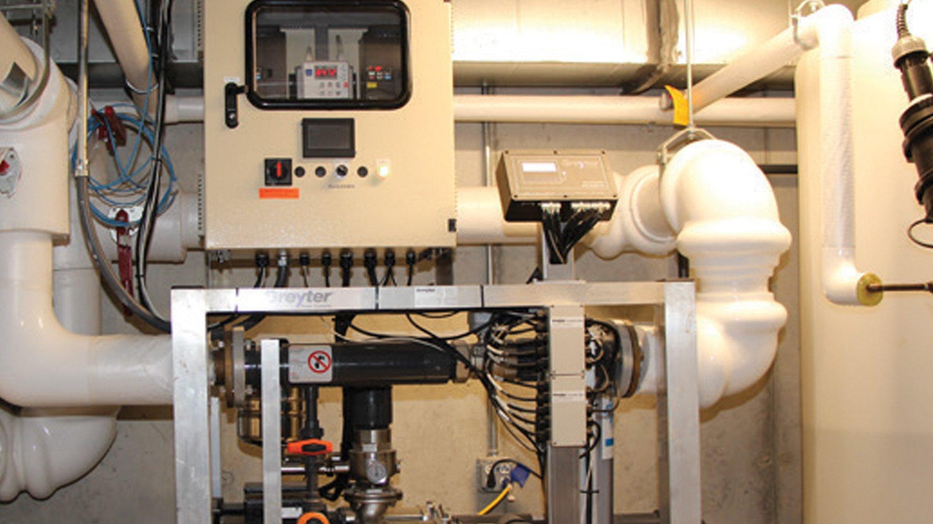 Digital display on Greyter commercial graywater reuse modules installed in a commercial space