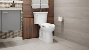 Lifestyle image of Kohler complete solution toilet in bathroom.