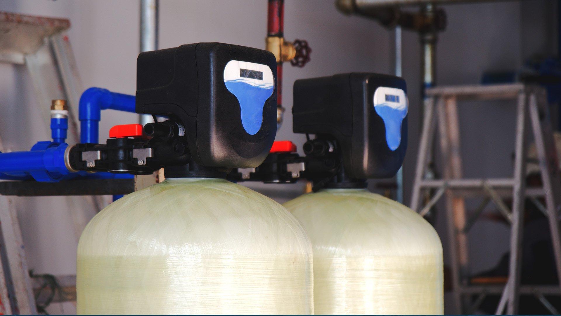 Close up image of installed water softener in commercial setting. 