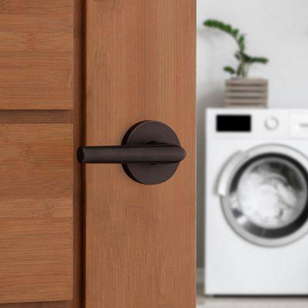 Kwikset Venetian Bronze Passage Lever 