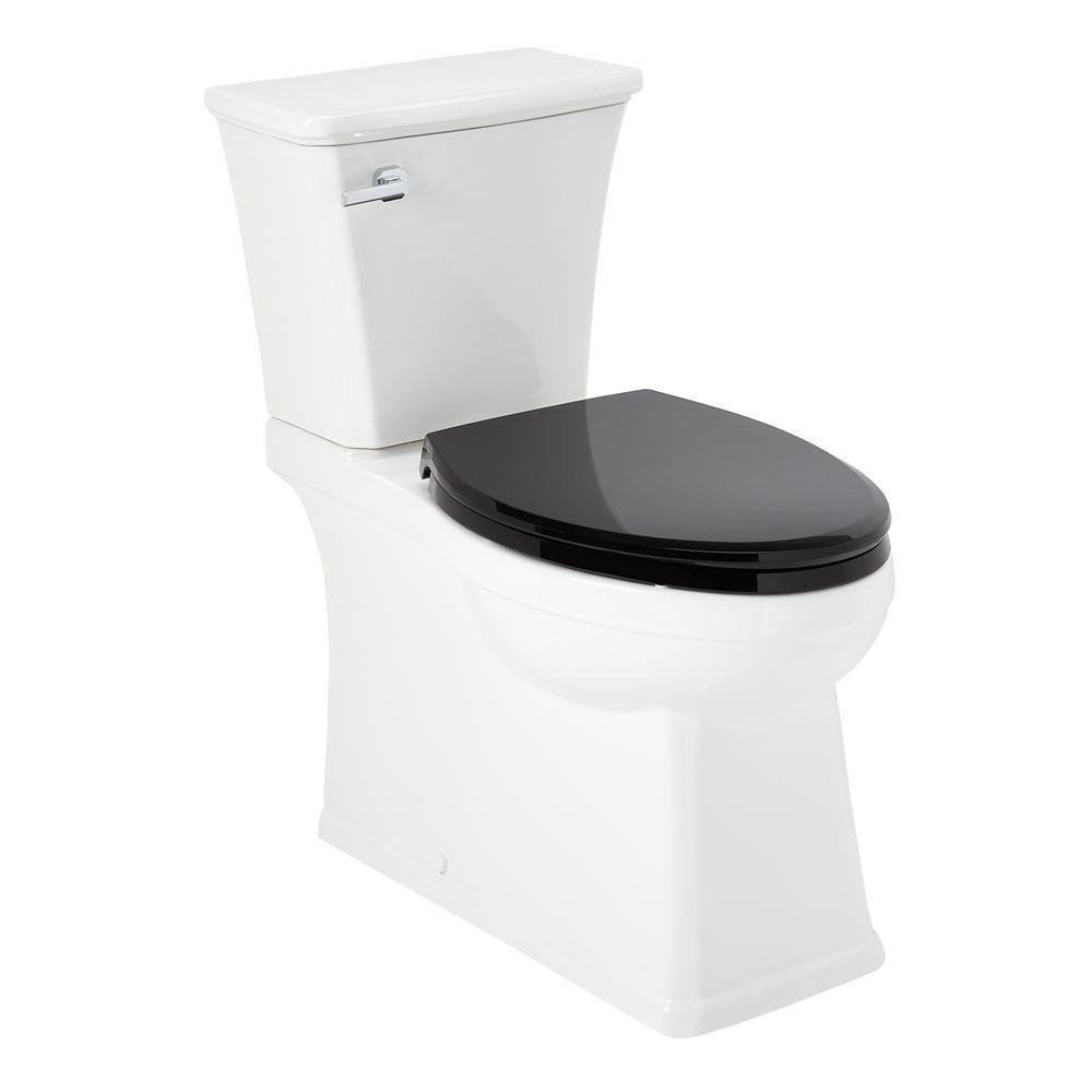 1.28 gpf Elongated Two Piece Skirted Toilet in White 