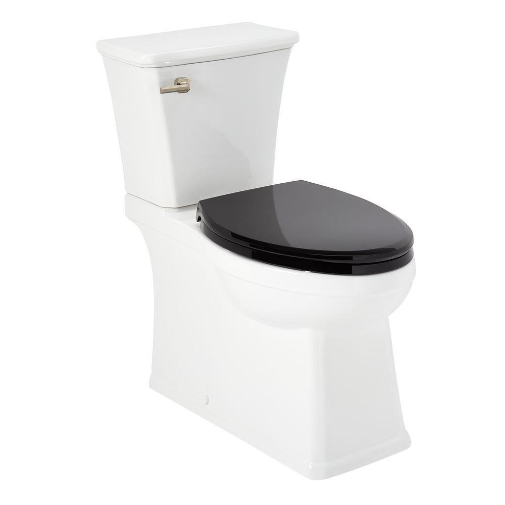 1.28 gpf Elongated Two Piece Skirted Toilet in White 