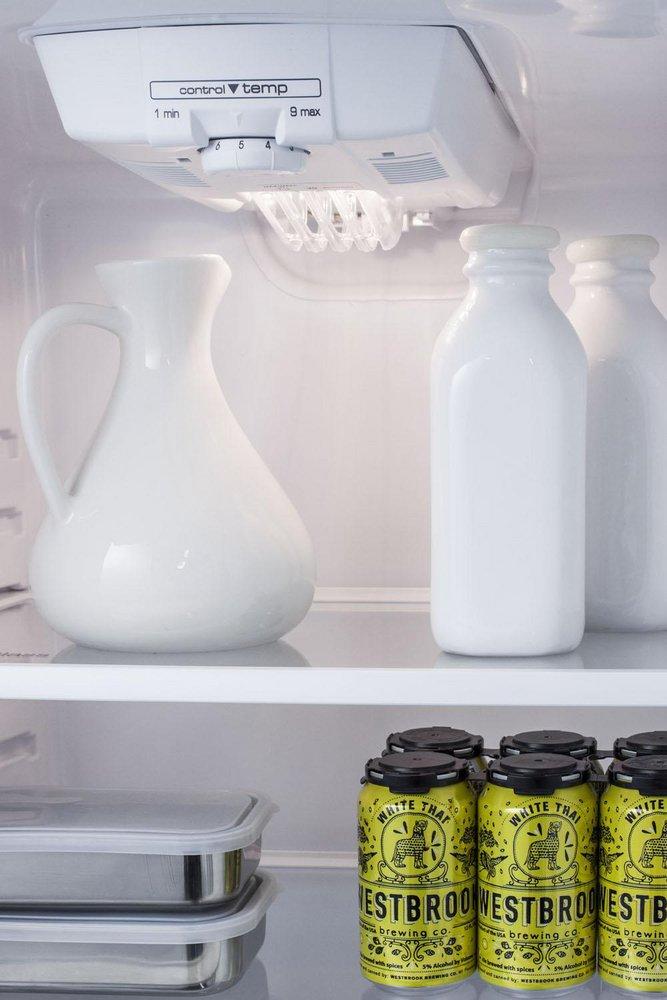 COUNTER DEPTH FROST-FREE REFRIGERATOR-FREEZER IN WHITE WITH A 26 FOOTPRINT REVERSIBLE DOORS & A COMBINATION LOCK 