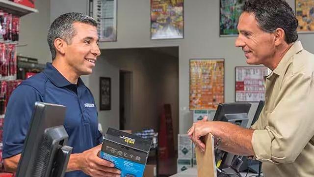 An associate assists a customer at a Ferguson location.
