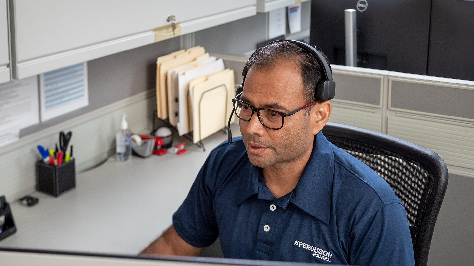 A Ferguson associate at the computer.