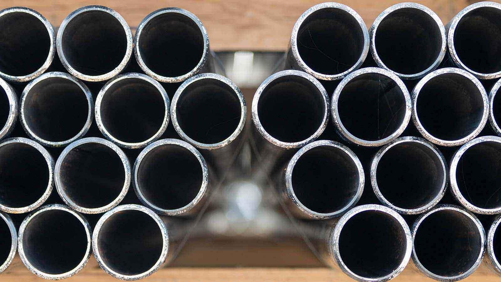 Close view of stacked pipe, with open ends facing viewer.