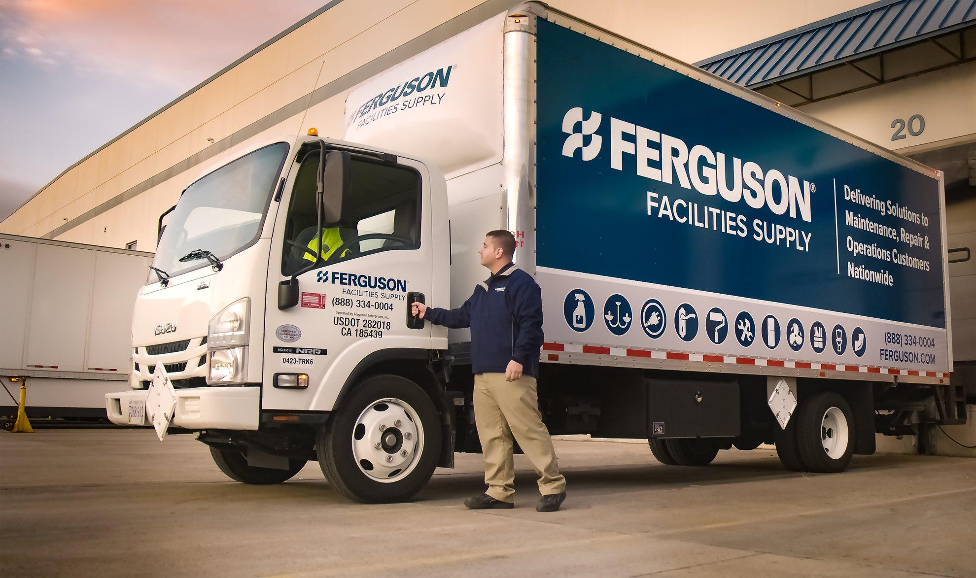 An associate opens the door to his Ferguson Facilities Supply delivery truck.