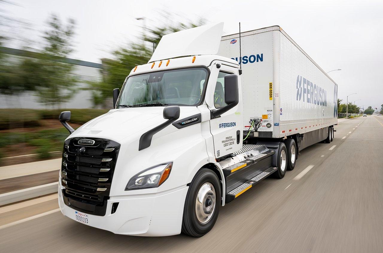 A Ferguson semi drives down a boulevard.