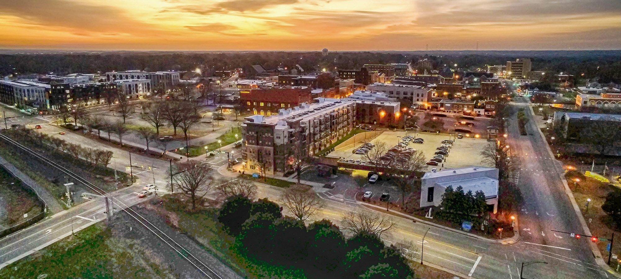 Downtown community aerial view at sunset. Read the case study on how predictive VODA.ai® modeling helps water utilities identify lead service lines and accelerate LCRR compliance.