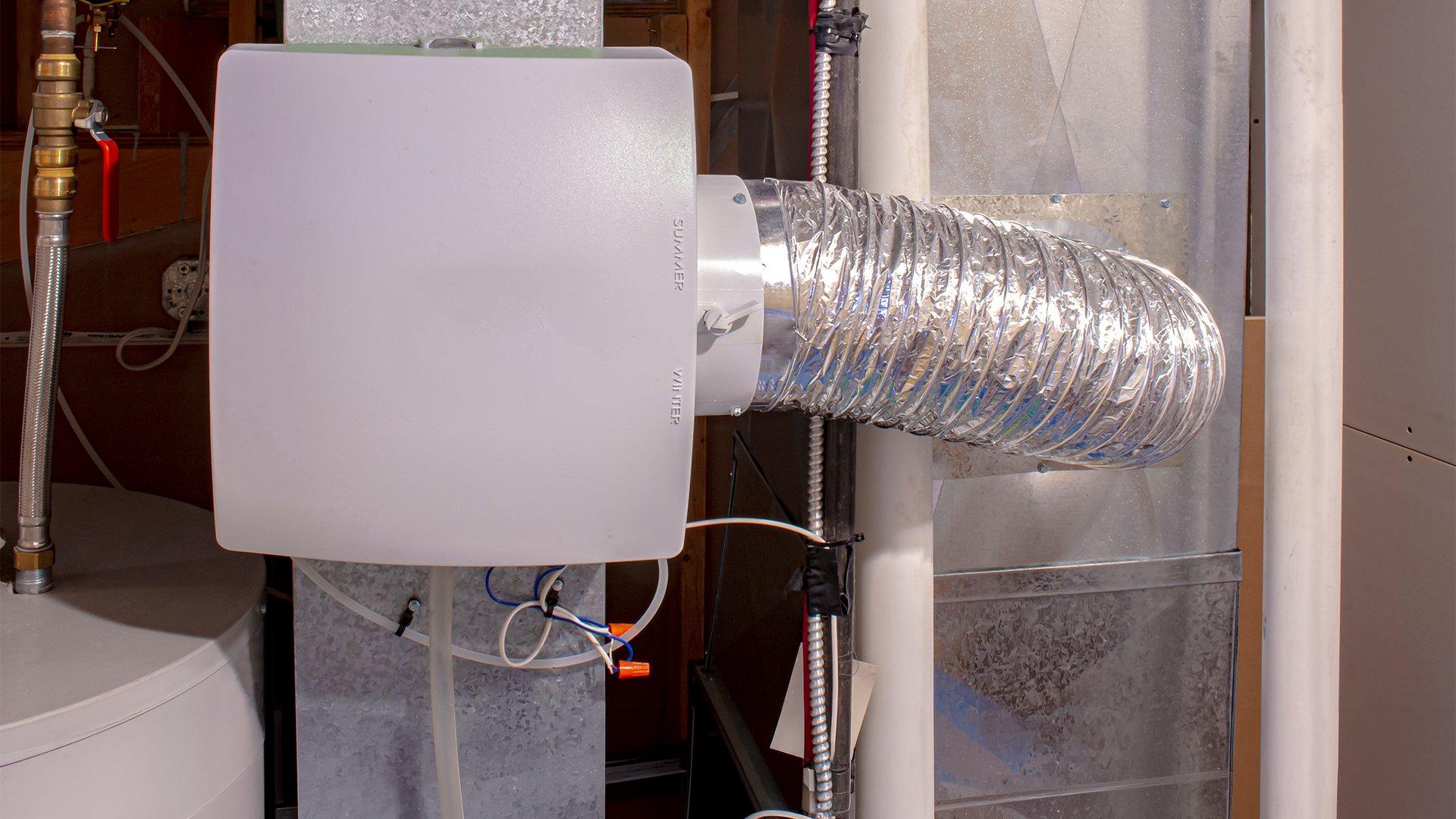 Close up image of whole house humidifier installed in residential home. 