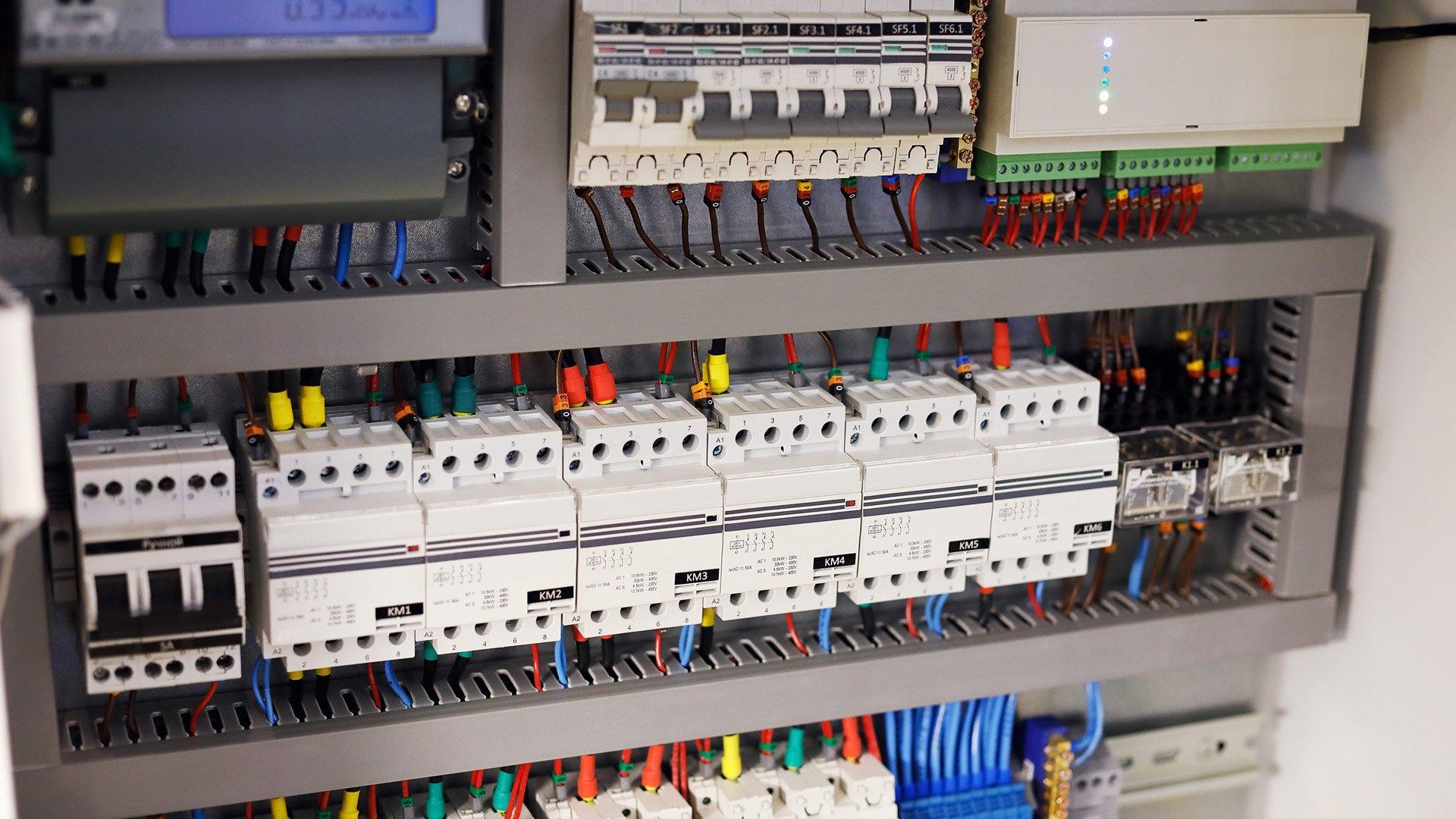 Modern electrical control panel for HVAC building automation system with components mounted and wired. 