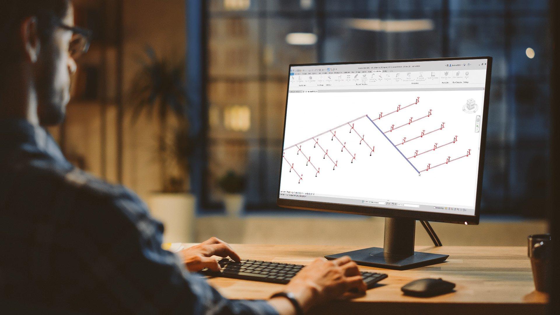 A contractor utilizes MicroBIM software on desktop screen. 