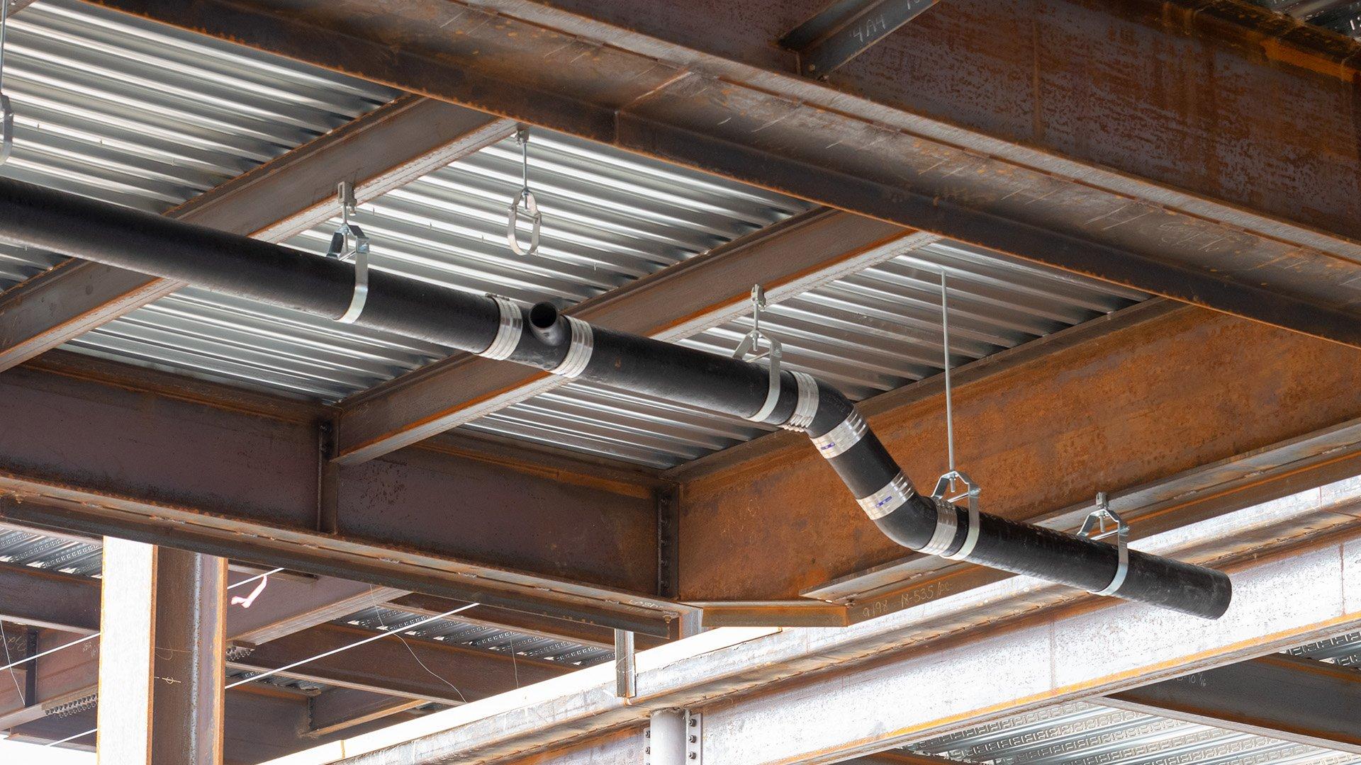 Jobsite with pipe and hangers for fire system