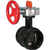 A black sprinkler valve with red faucet handle.