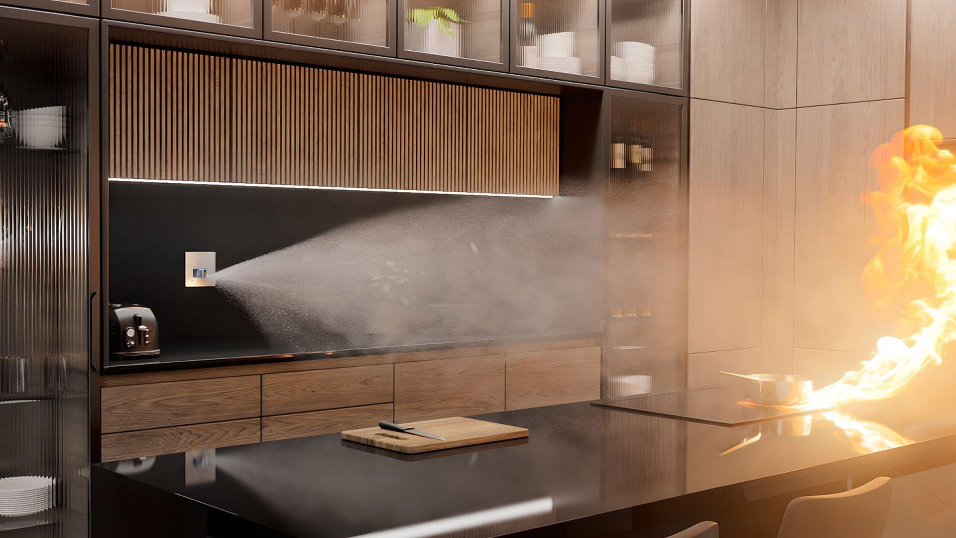 In a modern kitchen, an Automist wall sprinkler sprays water at a saucepan burning on an island stovetop.