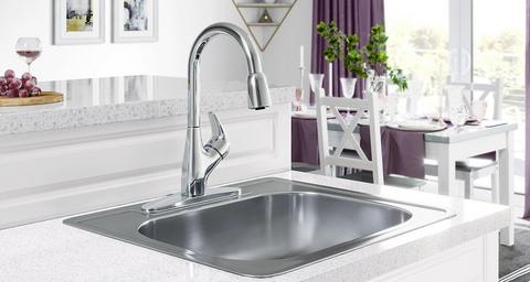 A white bathroom with walk-in shower and mirrors on the right.