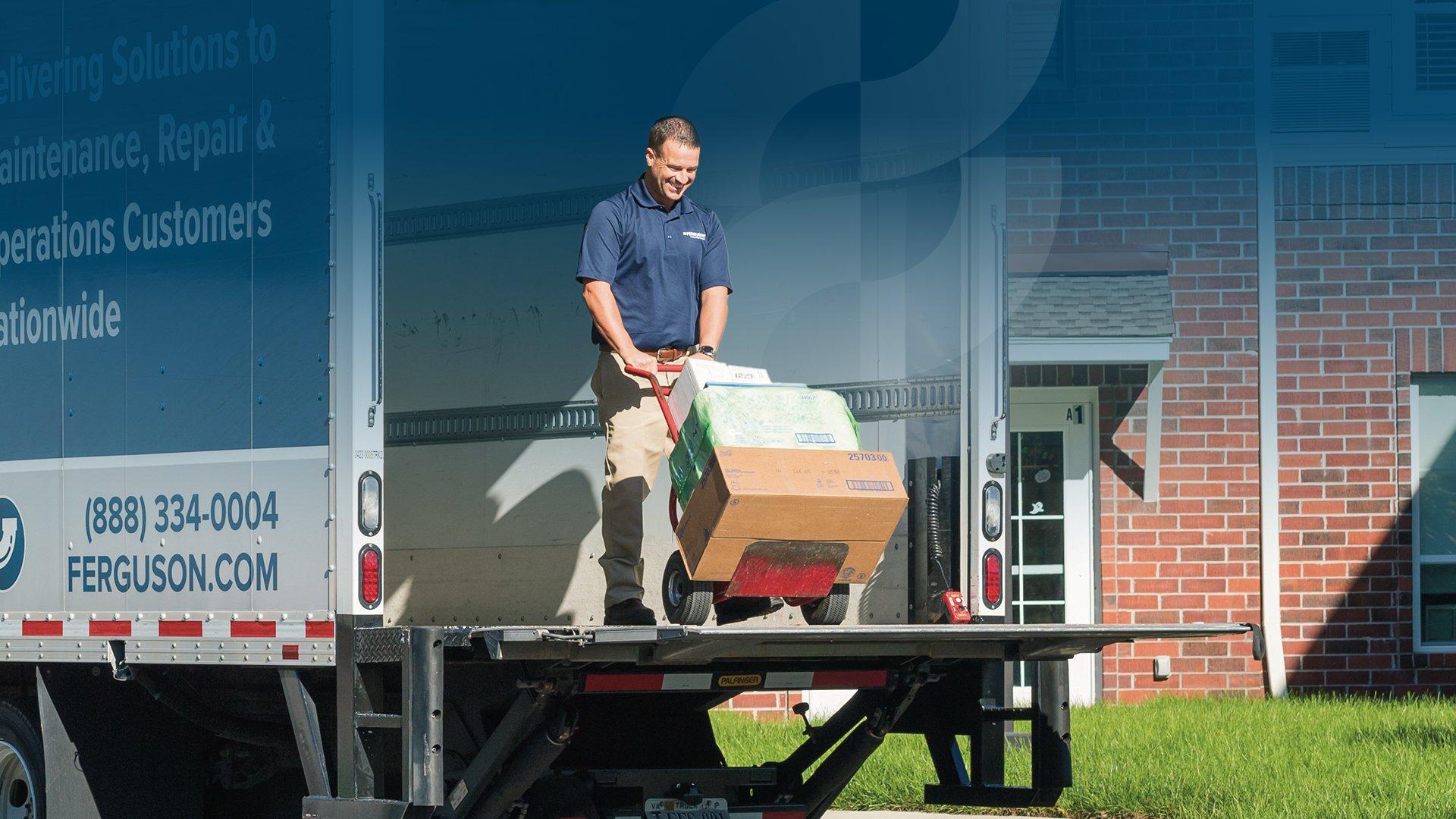 Ferguson associate moving items in a delivery truck