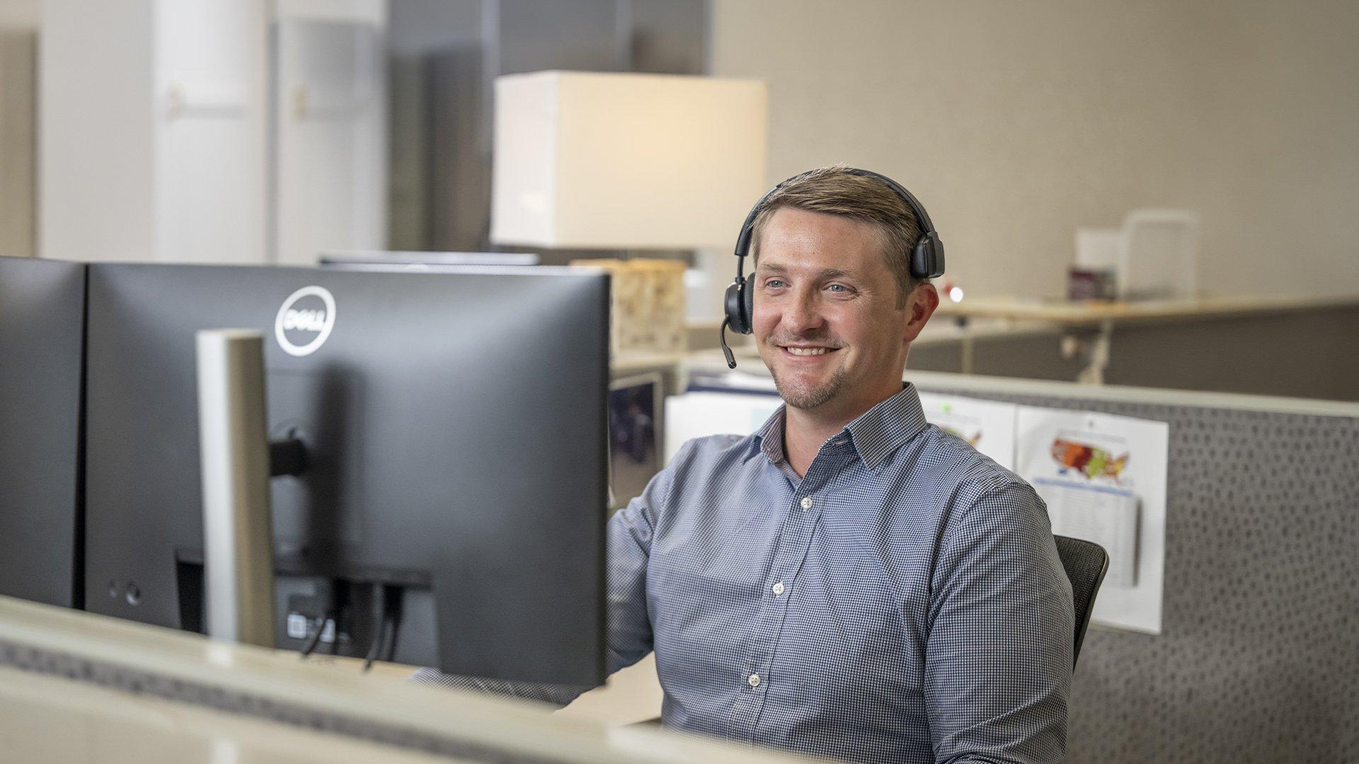 Image of Ferguson associate at desk with computer