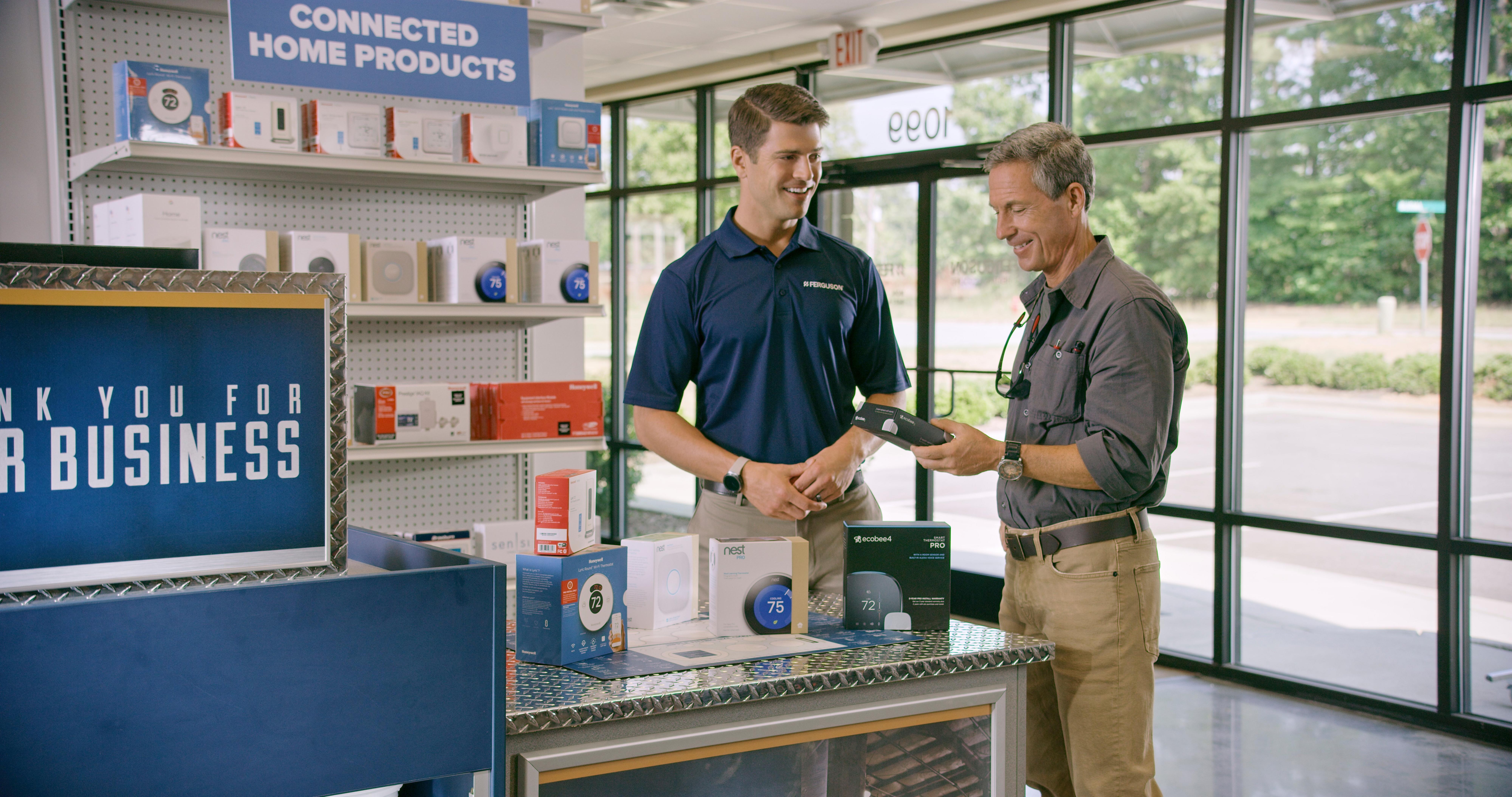 At a Ferguson Counter location, an associate discusses connected home products with a contractor.