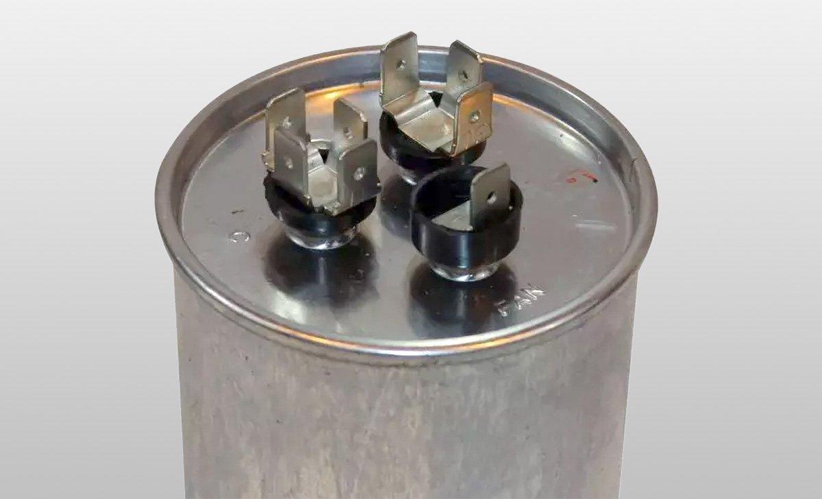 AC Capacitor close-up shot of terminal labels