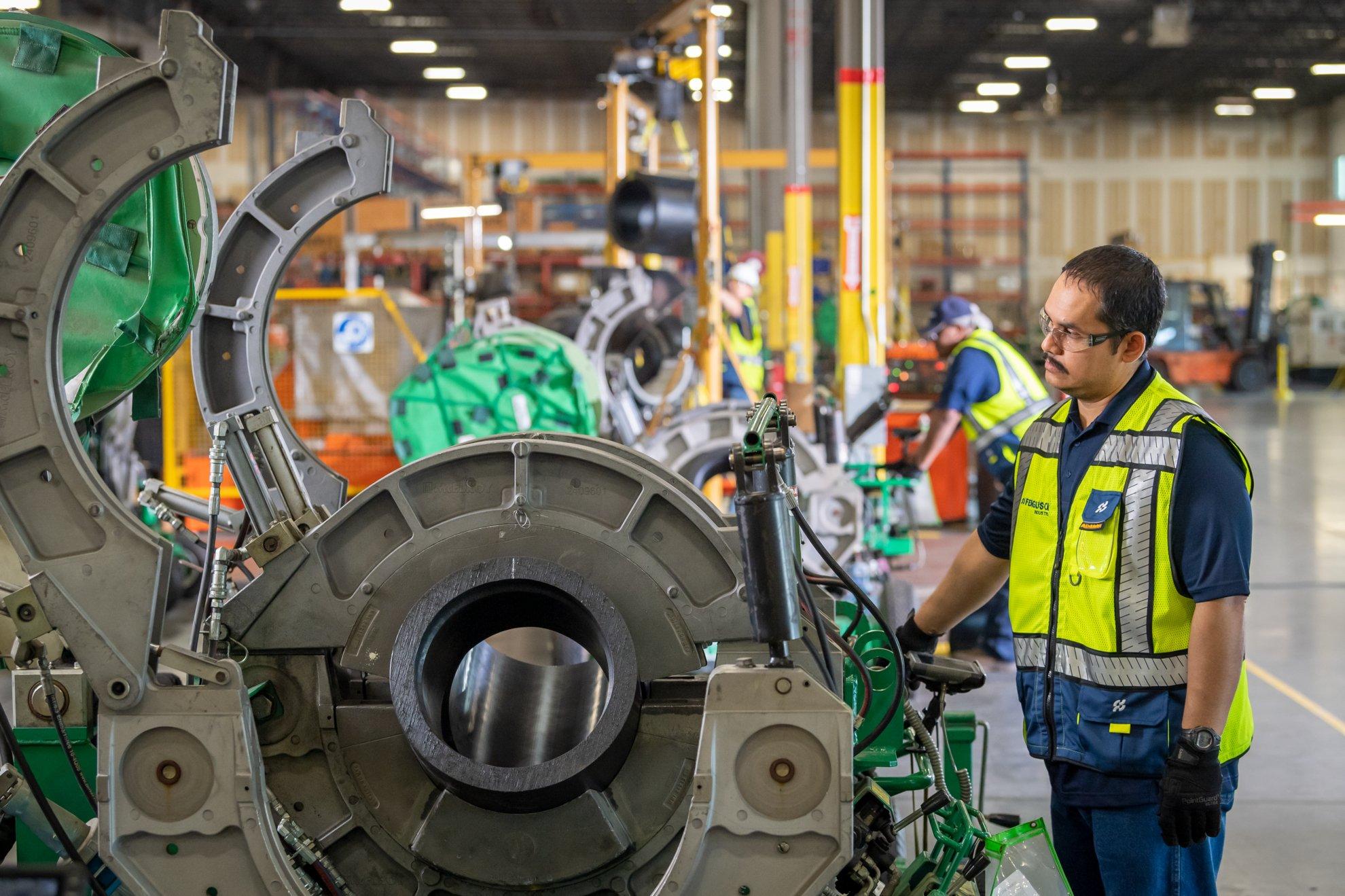 A Ferguson associate sets up a pipe fusion machine.