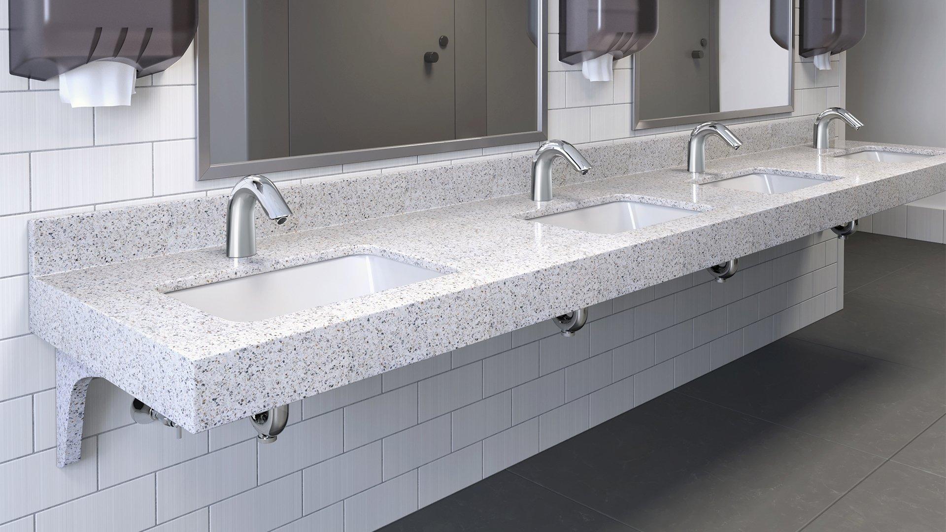 Counter mounted sensor faucets in a commercial setting.