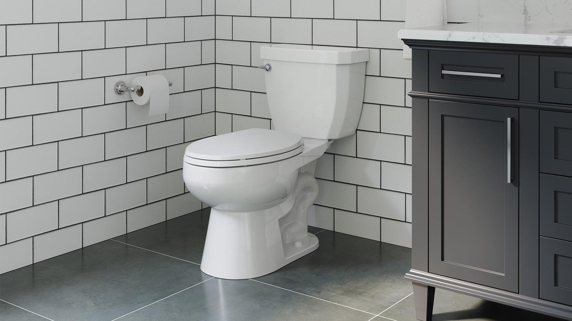 White, residential toilet installed in bathroom.