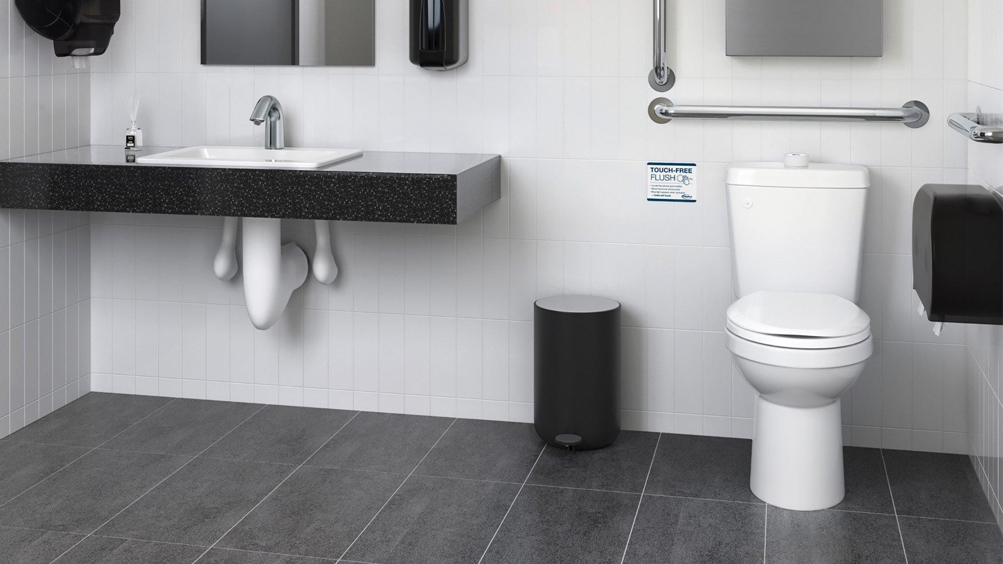 A commercial ADA-compliant single-user restroom, with grab bars, automatic soap and paper towel dispenser, and touchless faucet.