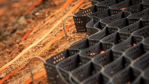 Geogrid is used to reinforce compacted soil.