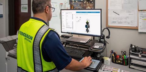 Ferguson Associate at a computer