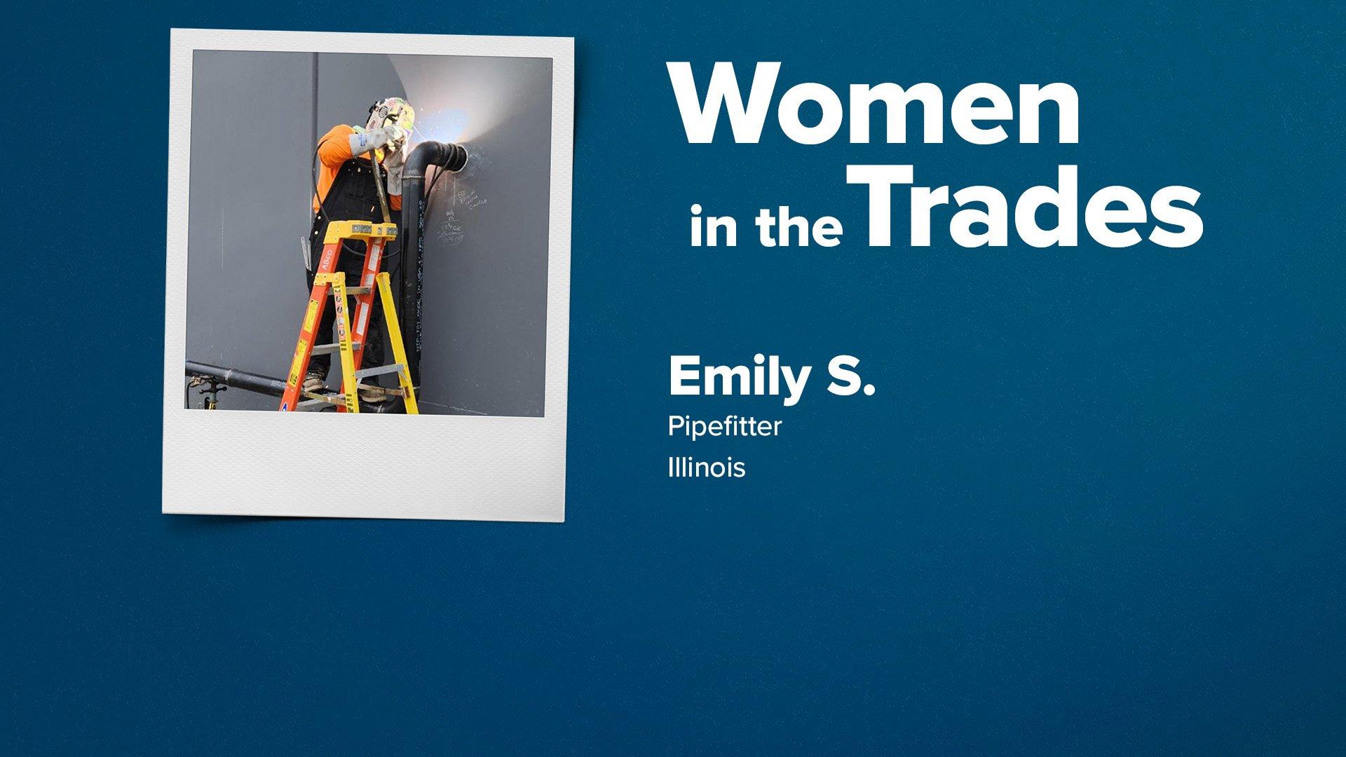 Emily Schranz, wearing a welding helmet and protective gloves, stands on a ladder and welds a black pipe next to a gray wall.