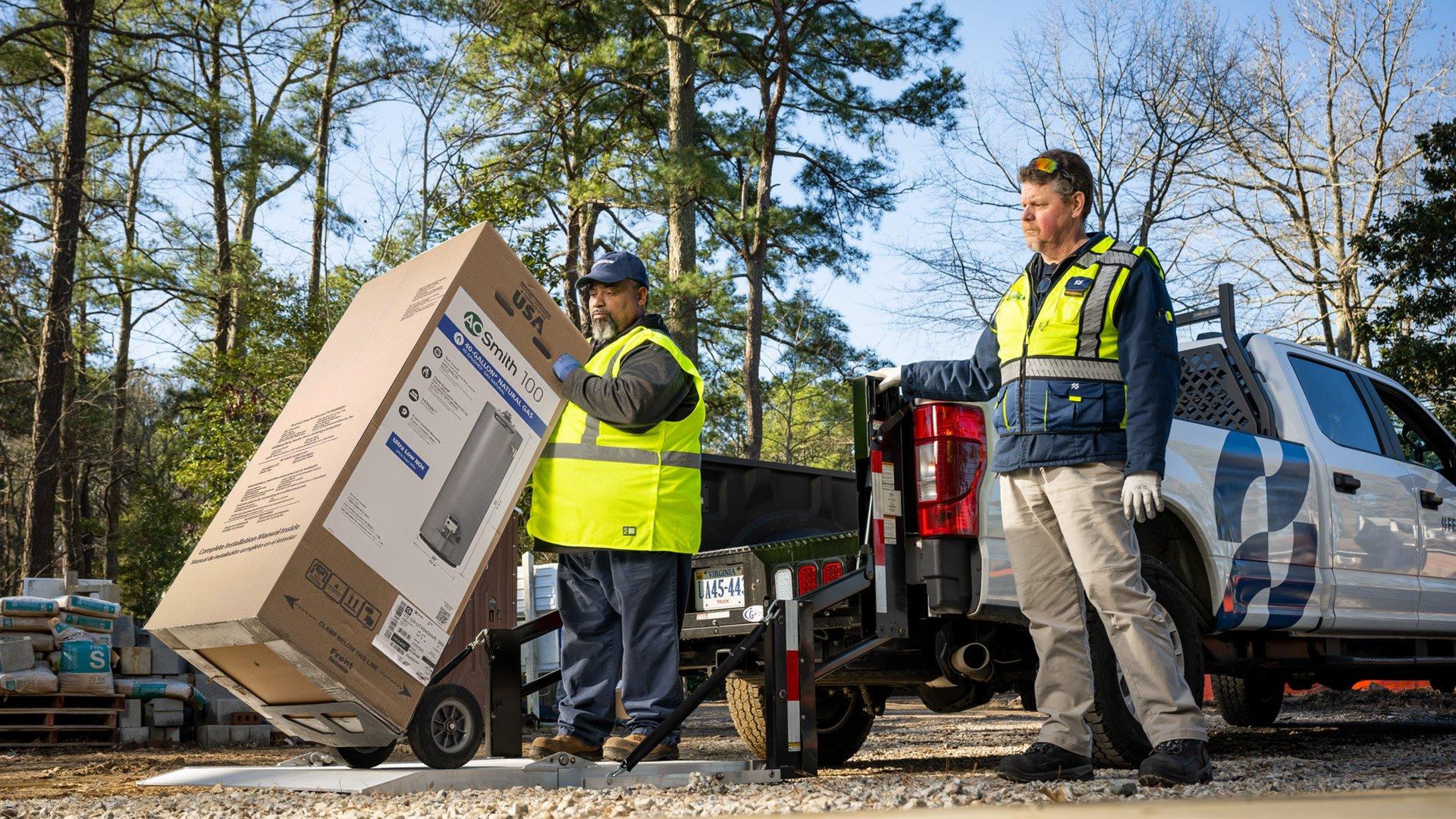Ferguson associates deliver an A. O. Smith residential water heater.