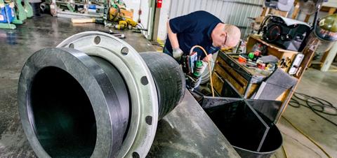 An associate scans products for a contractor at a Ferguson location.